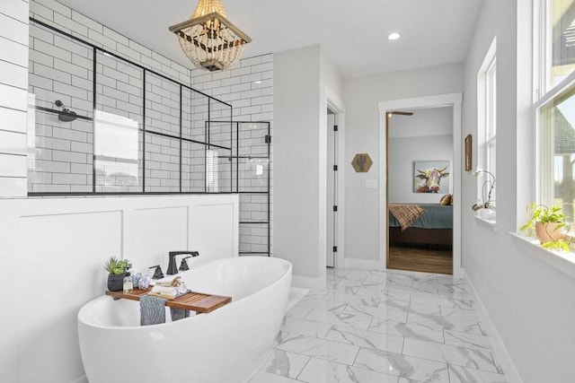 1215 Ropers Alley Rd, Belton, TX 76513 - ensuite bathroom featuring a freestanding tub, marble finish floor, ensuite bath, tiled shower, and baseboards
