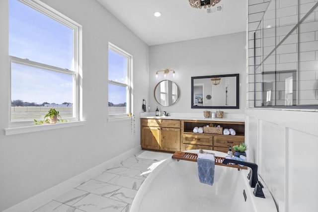 1215 Ropers Alley Rd, Belton, TX 76513 - full bathroom featuring vanity, visible vents, baseboards, a freestanding bath, and marble finish floor
