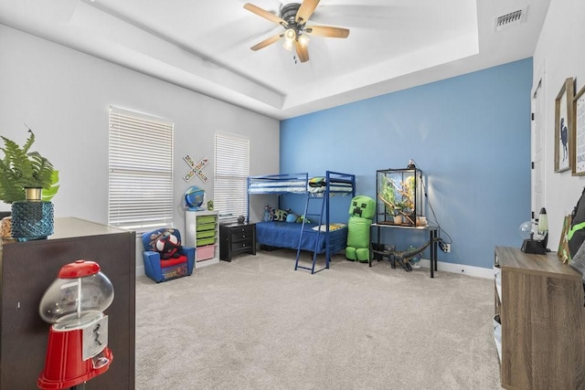 1215 Ropers Alley Rd, Belton, TX 76513 - carpeted bedroom featuring a raised ceiling, baseboards, visible vents, and ceiling fan