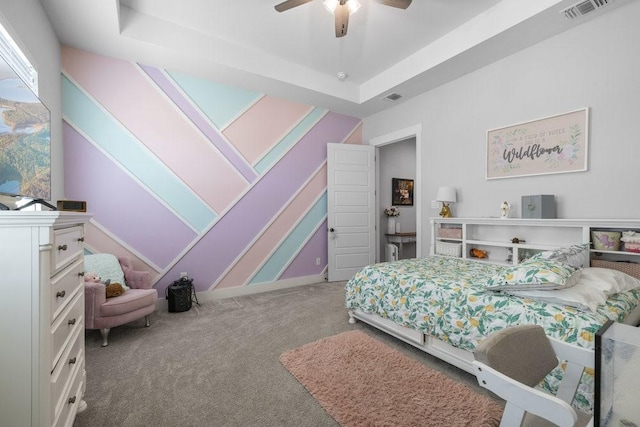 1215 Ropers Alley Rd, Belton, TX 76513 - carpeted bedroom with visible vents, a raised ceiling, and a ceiling fan