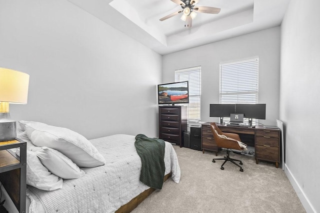 1215 Ropers Alley Rd, Belton, TX 76513 - bedroom with a tray ceiling, light carpet, baseboards, and a ceiling fan