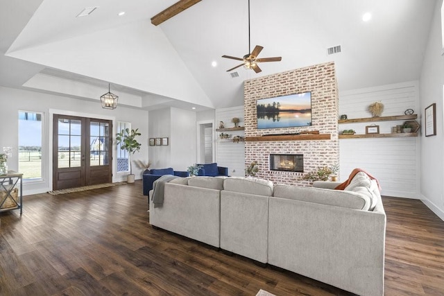 1215 Ropers Alley Rd, Belton, TX 76513 - living area featuring visible vents, high vaulted ceiling, dark wood-style flooring, french doors, and a brick fireplace