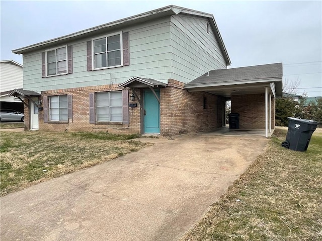 5505 Tennyson Dr, Waco, TX 76710 - view of front of home featuring a carport, concrete driveway, brick siding, and a front lawn