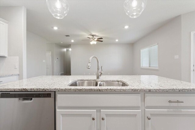 kitchen featuring a ceiling fan, recessed lighting, stainless steel dishwasher, a sink, and white cabinetry