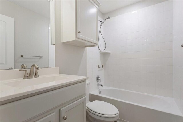full bathroom with toilet, bathing tub / shower combination, and vanity
