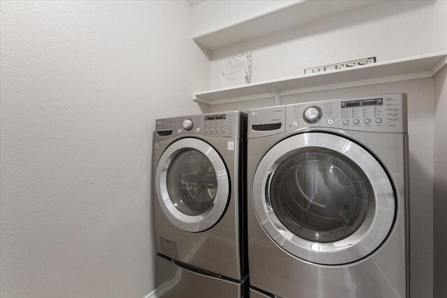 laundry area featuring laundry area and washer and clothes dryer