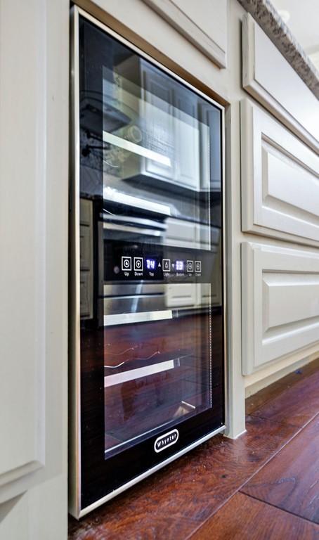 433 Sharron Dr, Woodway, TX 76712 - interior details with dark wood finished floors and wine cooler