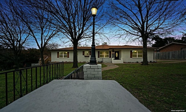 433 Sharron Dr, Woodway, TX 76712 - rear view of property featuring a lawn, brick siding, and fence