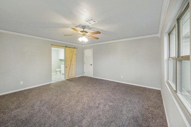 433 Sharron Dr, Woodway, TX 76712 - carpeted empty room featuring crown molding, baseboards, visible vents, and ceiling fan