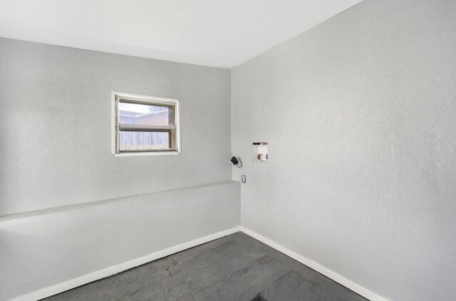 433 Sharron Dr, Woodway, TX 76712 - empty room with baseboards and concrete floors