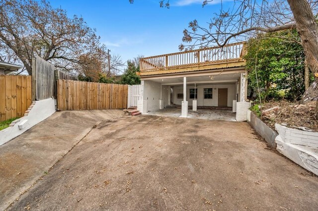 433 Sharron Dr, Woodway, TX 76712 - exterior space featuring a carport, a deck, driveway, and fence