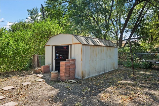 view of shed with fence