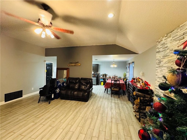 5703 Mandalay Dr, Killeen, TX 76549 - living area featuring a ceiling fan, a textured ceiling, wood finished floors, baseboards, and vaulted ceiling