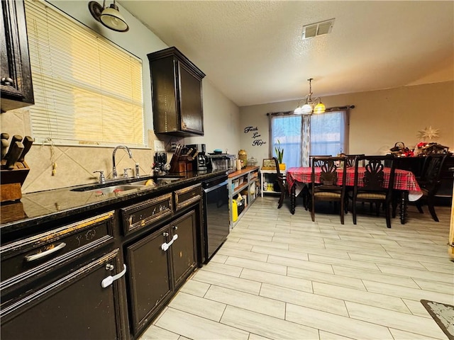 5703 Mandalay Dr, Killeen, TX 76549 - kitchen with visible vents, a chandelier, dishwasher, a textured ceiling, and a sink
