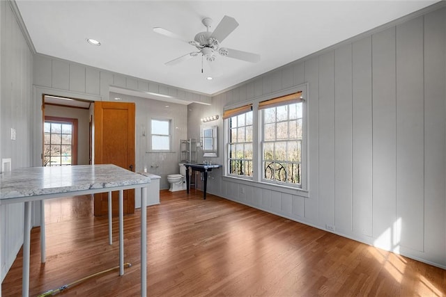 3100 Austin Ave, Waco, TX 76710 - interior space featuring a ceiling fan, wood finished floors, and a decorative wall