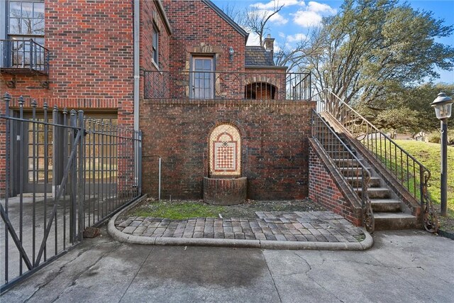 3100 Austin Ave, Waco, TX 76710 - exterior space featuring brick siding, a chimney, and fence