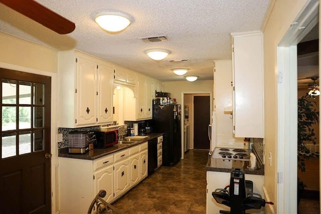 332 Crescent Dr, Hewitt, TX 76643 - kitchen featuring black appliances, dark countertops, tasteful backsplash, a textured ceiling, and white cabinetry