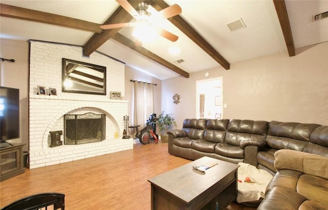 332 Crescent Dr, Hewitt, TX 76643 - living area with wood finished floors, a ceiling fan, and a fireplace