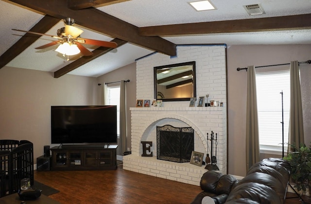 332 Crescent Dr, Hewitt, TX 76643 - living area featuring wood finished floors, ceiling fan, and a fireplace
