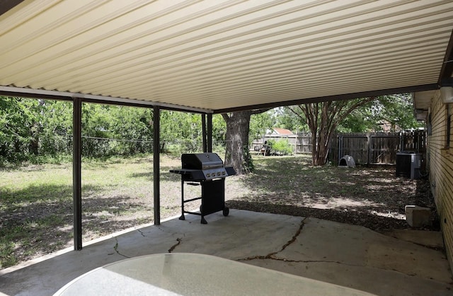 332 Crescent Dr, Hewitt, TX 76643 - fenced backyard with a patio area, a grill, and a carport