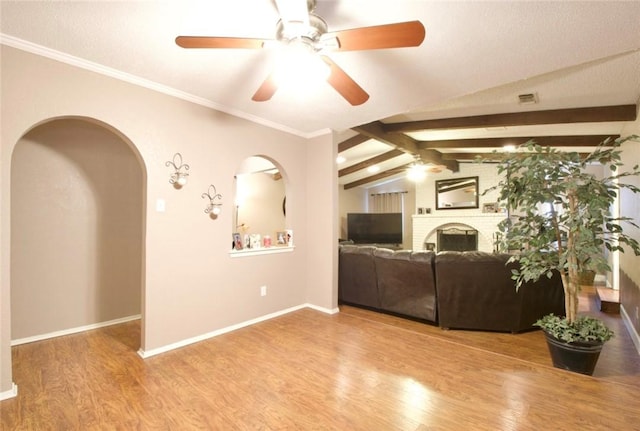 332 Crescent Dr, Hewitt, TX 76643 - living room with a ceiling fan, wood finished floors, arched walkways, and baseboards