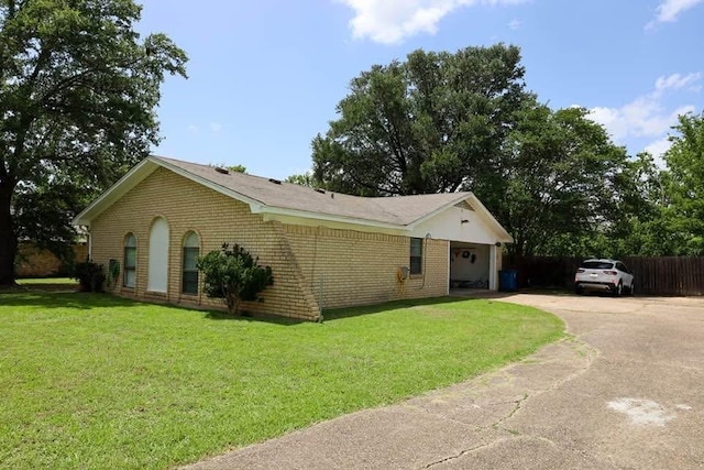 332 Crescent Dr, Hewitt, TX 76643 - view of side of home featuring driveway, a garage, and brick siding