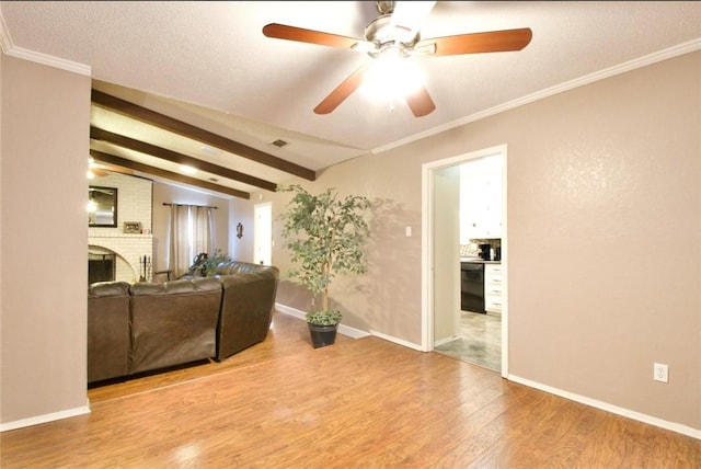 332 Crescent Dr, Hewitt, TX 76643 - living room featuring wood finished floors, a ceiling fan, a brick fireplace, vaulted ceiling, and baseboards