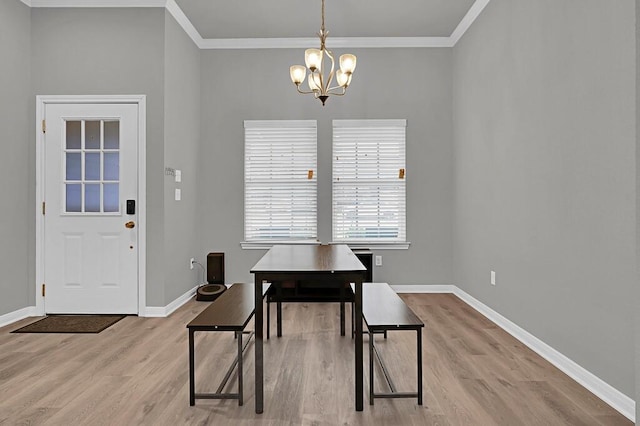 429 Travis Dr, Mcgregor, TX 76657 - dining space with baseboards, crown molding, an inviting chandelier, and wood finished floors