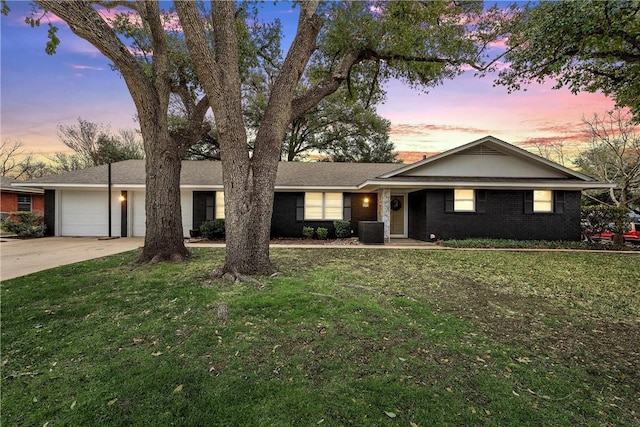 4209 Chestnut Rd, Temple, TX 76502 - single story home featuring brick siding, a garage, a lawn, and driveway