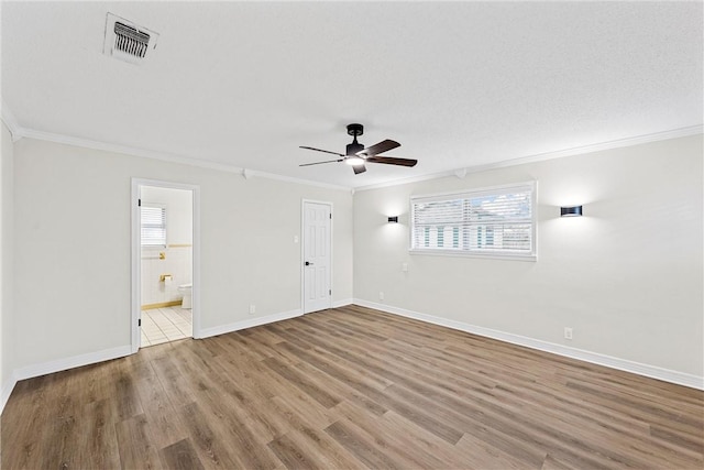 4209 Chestnut Rd, Temple, TX 76502 - unfurnished bedroom with visible vents, baseboards, wood finished floors, and crown molding