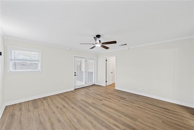 4209 Chestnut Rd, Temple, TX 76502 - spare room with light wood-type flooring, a ceiling fan, a healthy amount of sunlight, and crown molding