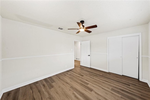 4209 Chestnut Rd, Temple, TX 76502 - unfurnished bedroom featuring visible vents, baseboards, wood finished floors, a closet, and a ceiling fan