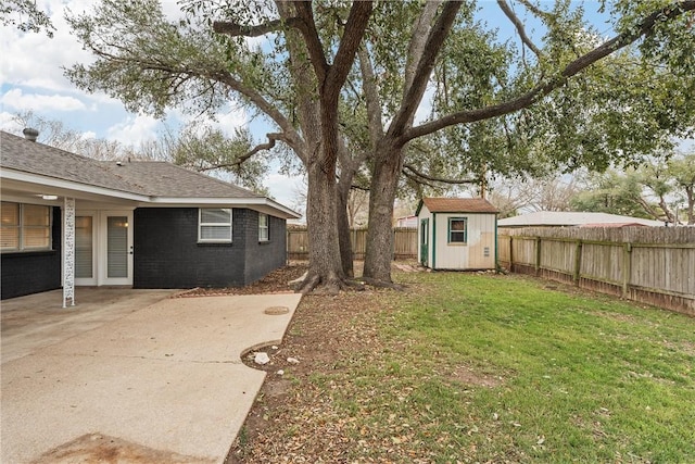 4209 Chestnut Rd, Temple, TX 76502 - view of yard featuring a fenced backyard, a patio, an outdoor structure, and a shed