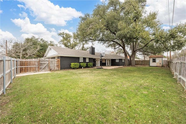 4209 Chestnut Rd, Temple, TX 76502 - view of yard featuring a storage unit, an outdoor structure, a fenced backyard, and a patio area