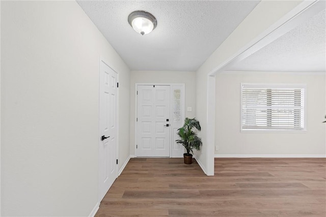 4209 Chestnut Rd, Temple, TX 76502 - entrance foyer featuring a textured ceiling, baseboards, and wood finished floors