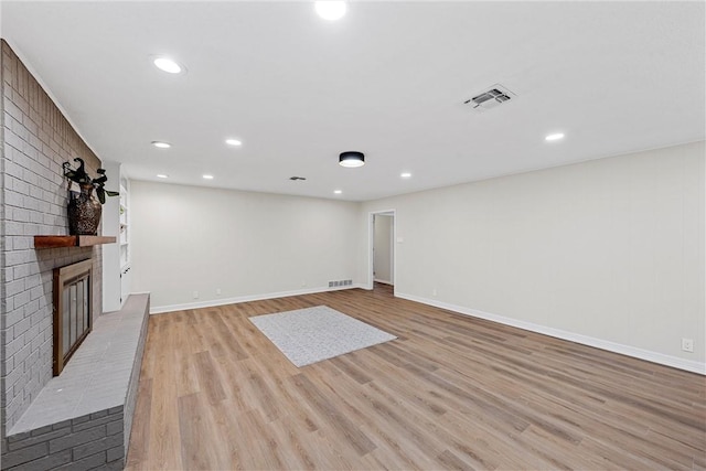 4209 Chestnut Rd, Temple, TX 76502 - unfurnished living room with baseboards, a fireplace, visible vents, and light wood-type flooring
