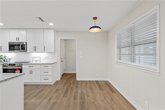 4209 Chestnut Rd, Temple, TX 76502 - kitchen featuring visible vents, white cabinetry, appliances with stainless steel finishes, and light countertops