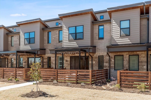 851 Cavitt Ct, Prosper, TX 75078 - multi unit property with a fenced front yard and brick siding
