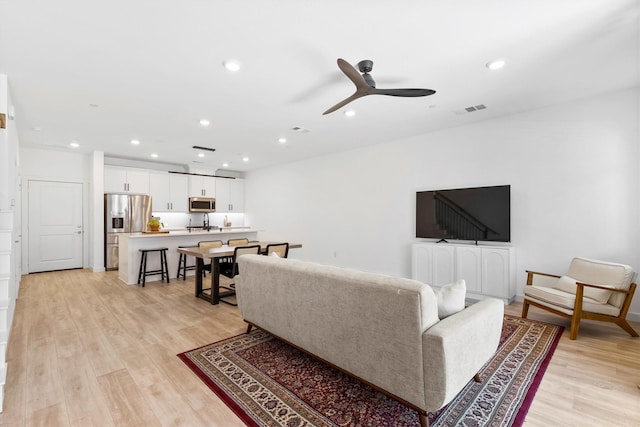 851 Cavitt Ct, Prosper, TX 75078 - living area with light wood-style floors, recessed lighting, and a ceiling fan