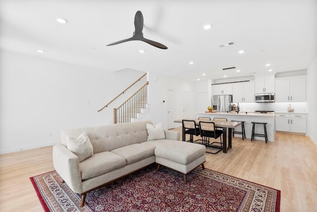 851 Cavitt Ct, Prosper, TX 75078 - living room featuring light wood finished floors, stairs, recessed lighting, a ceiling fan, and baseboards