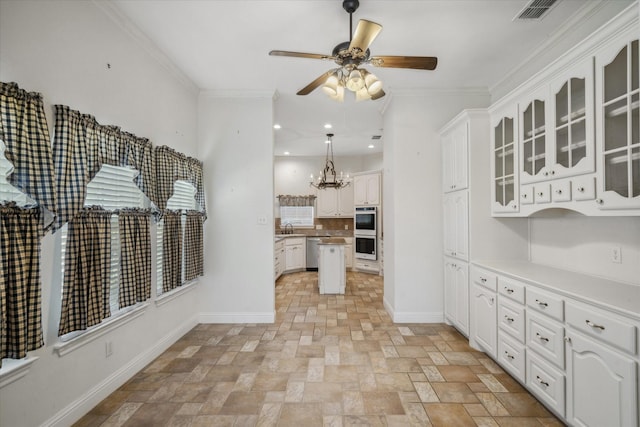 kitchen featuring white double oven, baseboards, dishwasher, ornamental molding, and a sink