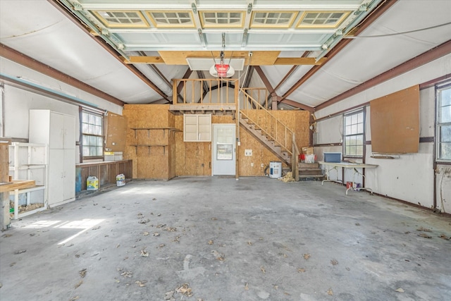 garage featuring a workshop area and a garage door opener