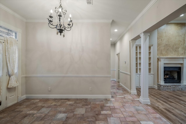 unfurnished dining area featuring baseboards, ornate columns, a fireplace, stone finish flooring, and crown molding