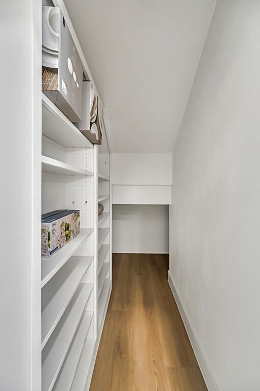 707 S 9th St, Waco, TX 76706 - walk in closet with wood finished floors