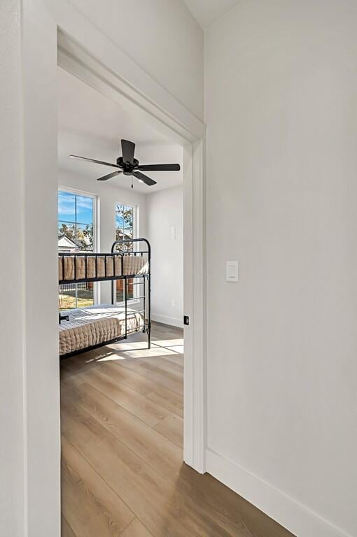 707 S 9th St, Waco, TX 76706 - bedroom with wood finished floors, baseboards, and ceiling fan