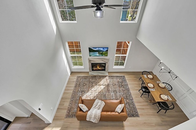 707 S 9th St, Waco, TX 76706 - living area with a towering ceiling, baseboards, a ceiling fan, and wood finished floors