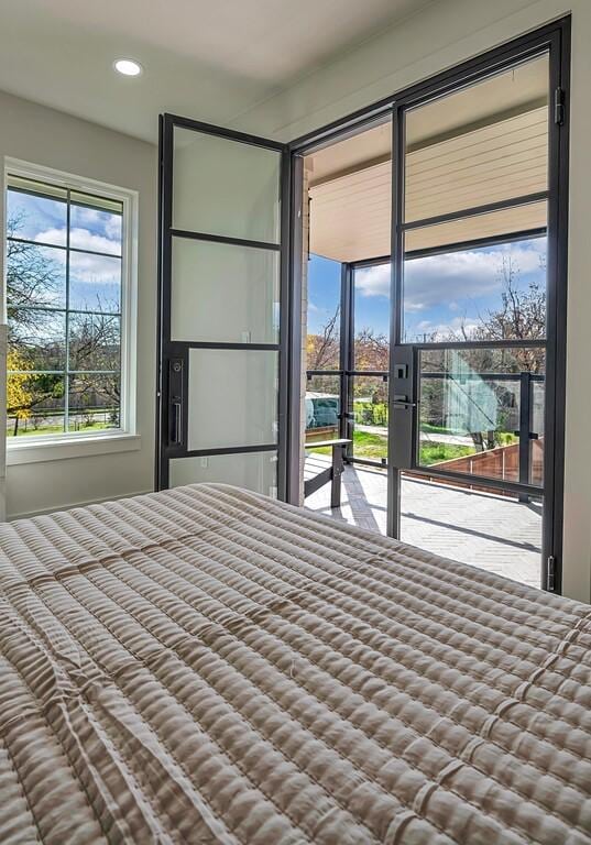 707 S 9th St, Waco, TX 76706 - unfurnished bedroom featuring recessed lighting and access to exterior