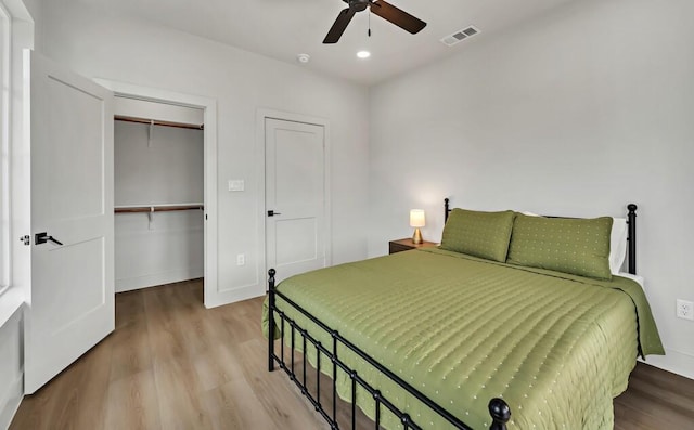 707 S 9th St, Waco, TX 76706 - bedroom featuring visible vents, baseboards, wood finished floors, and a ceiling fan