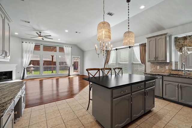 8664 Glenburne Dr, Fort Worth, TX 76131 - kitchen with a sink, light tile patterned floors, stainless steel dishwasher, and open floor plan
