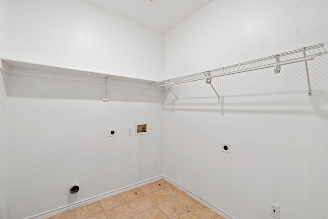 8664 Glenburne Dr, Fort Worth, TX 76131 - washroom with baseboards, hookup for an electric dryer, laundry area, and hookup for a washing machine